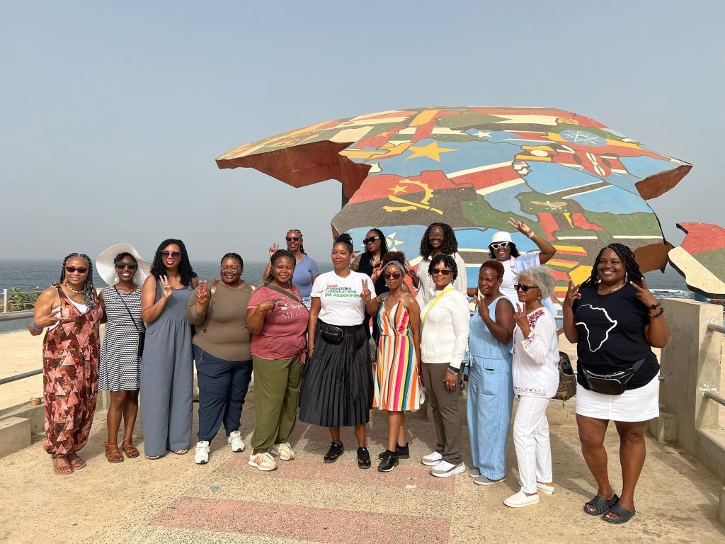 Group of Travel Divas in front of Africa display in Senegal