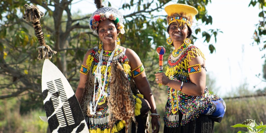 Two women dressed in colorful traditional Zulu attire, South Africa
